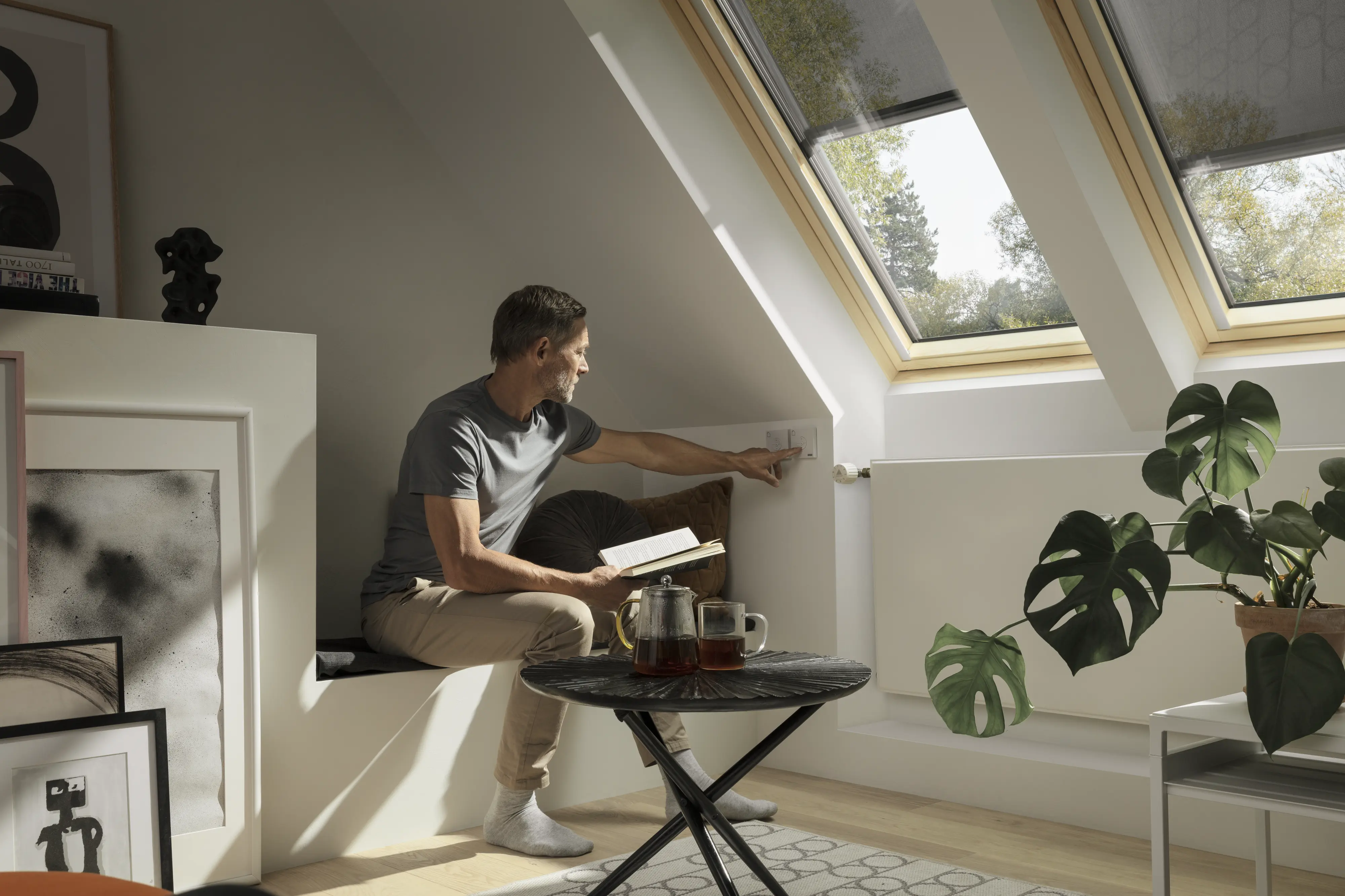 A man sitting by the roofwindow