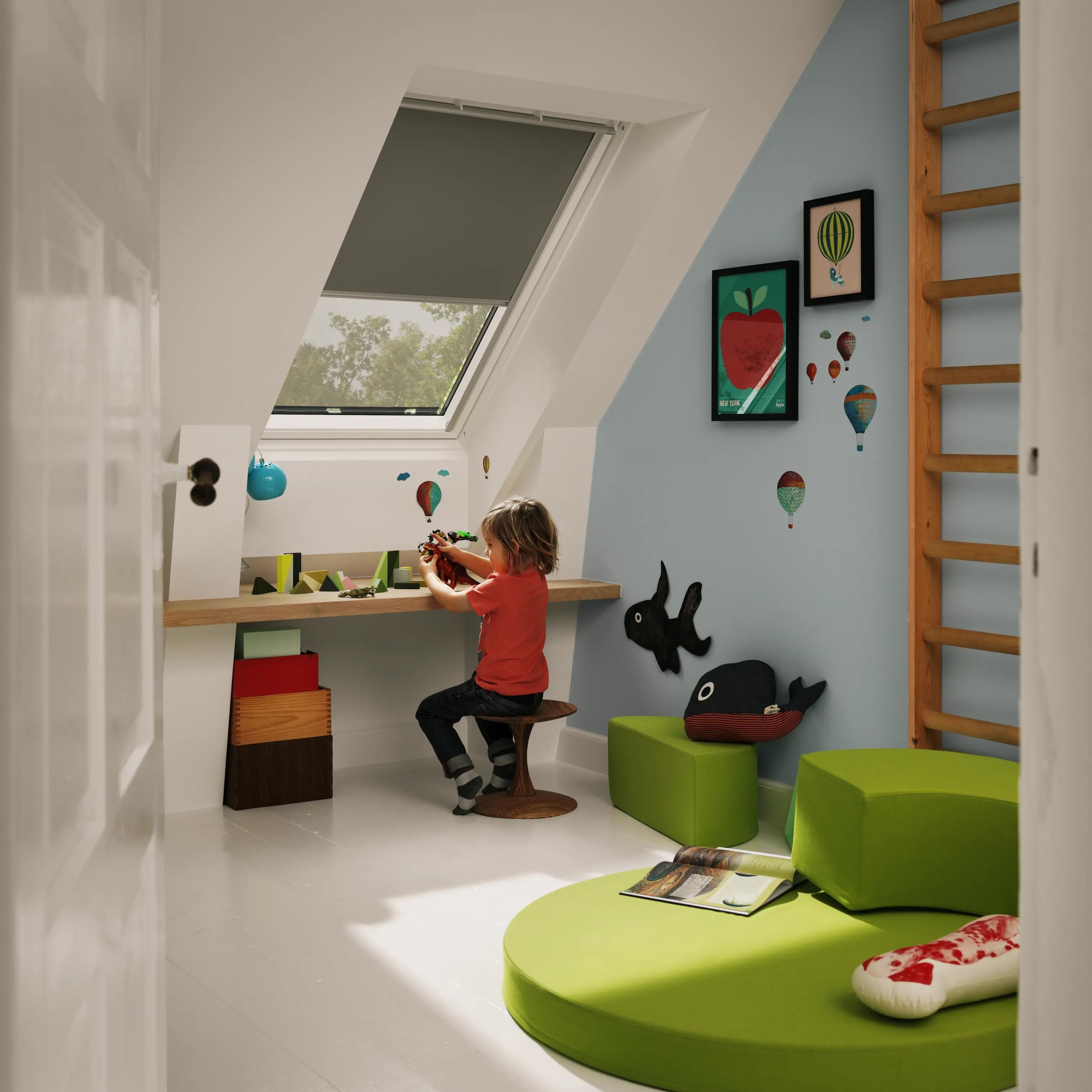 Kids room with sloped ceiling and VELUX roof window, child playing at desk.