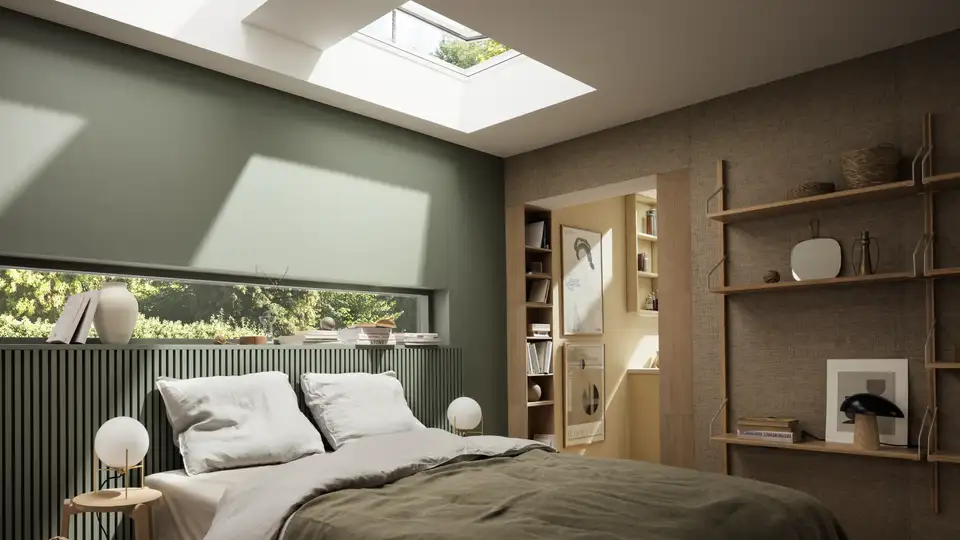 Camera da letto con arredamento moderno e finestre per tetti piani VELUX aperte sopra la testiera del letto.