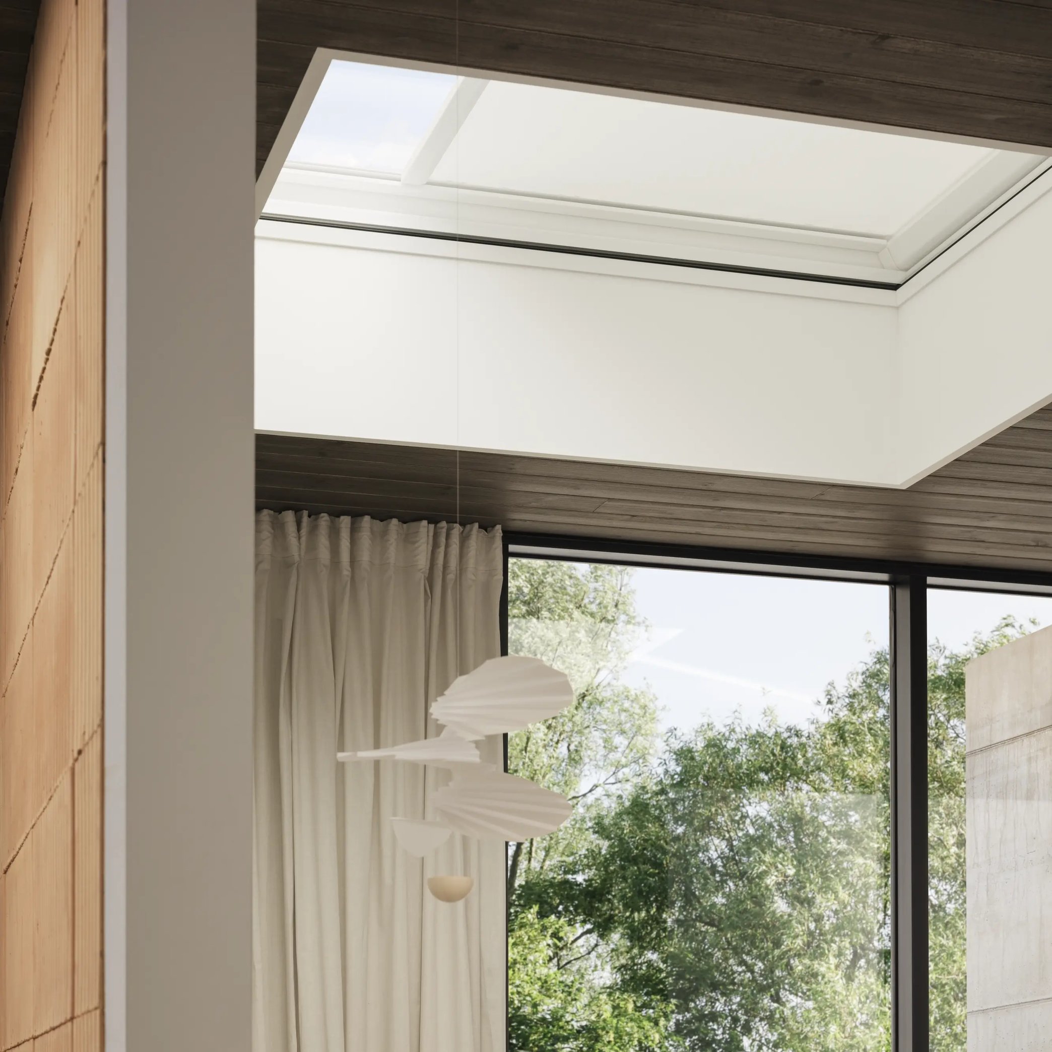 Home office with VELUX roof window, modern decor, and natural light.