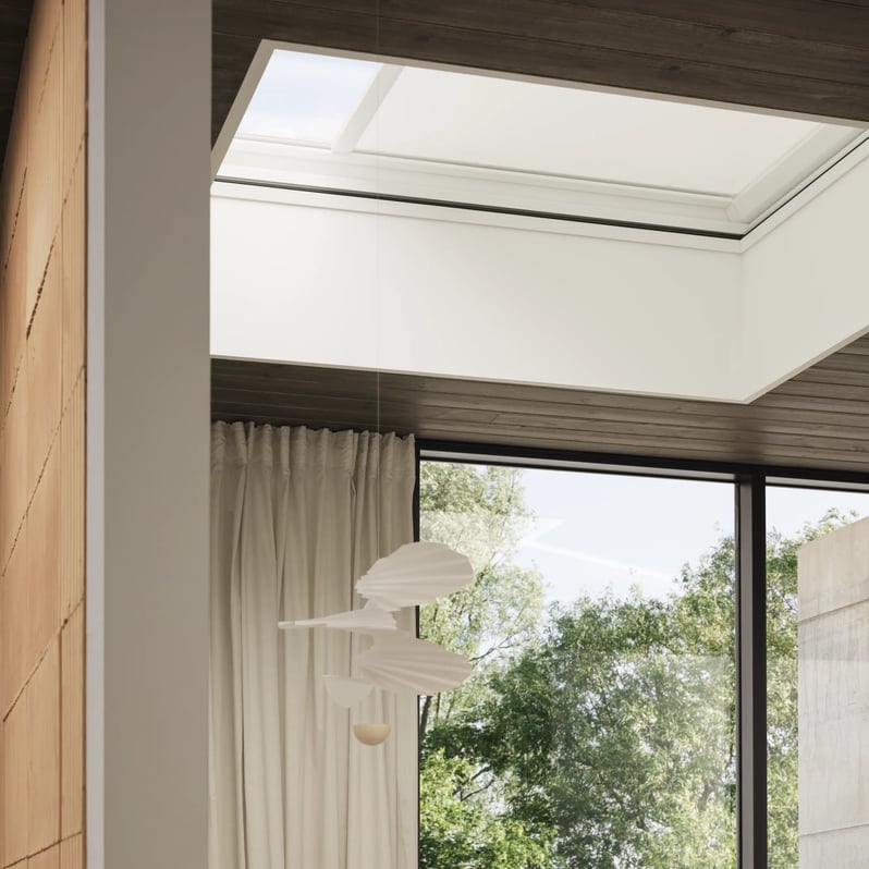 Home office with VELUX roof window, modern decor, and natural light.
