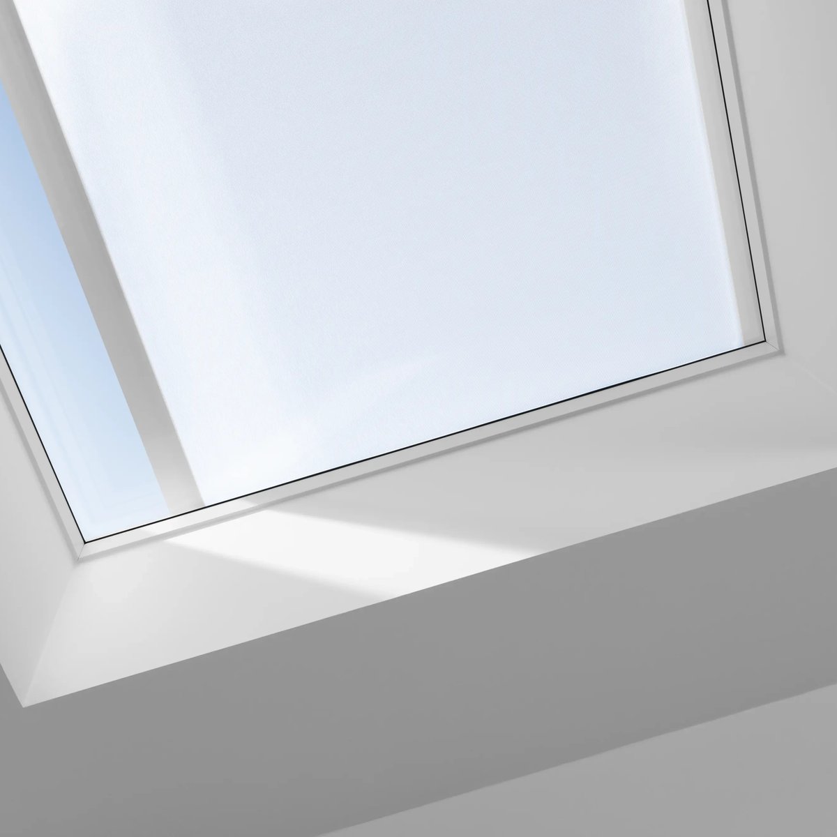 VELUX roof window in a flat ceiling, offering natural light.