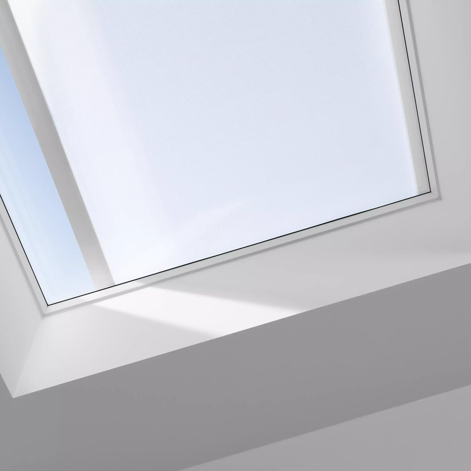 VELUX roof window in a flat ceiling, offering natural light.