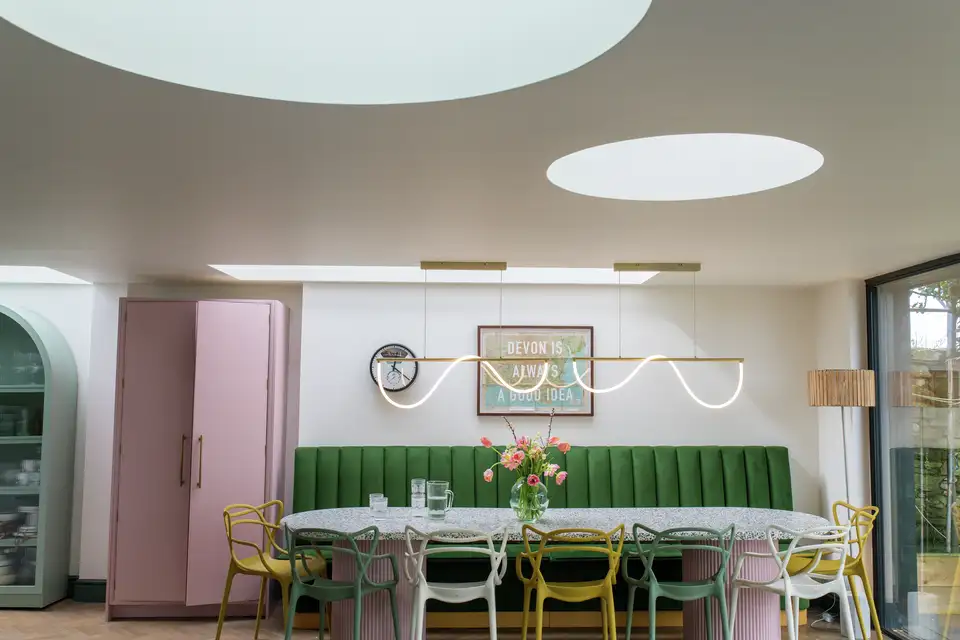 Inspiring kitchen decor: An awe-inspiring makeover with two large circular skylights that brighten the space.