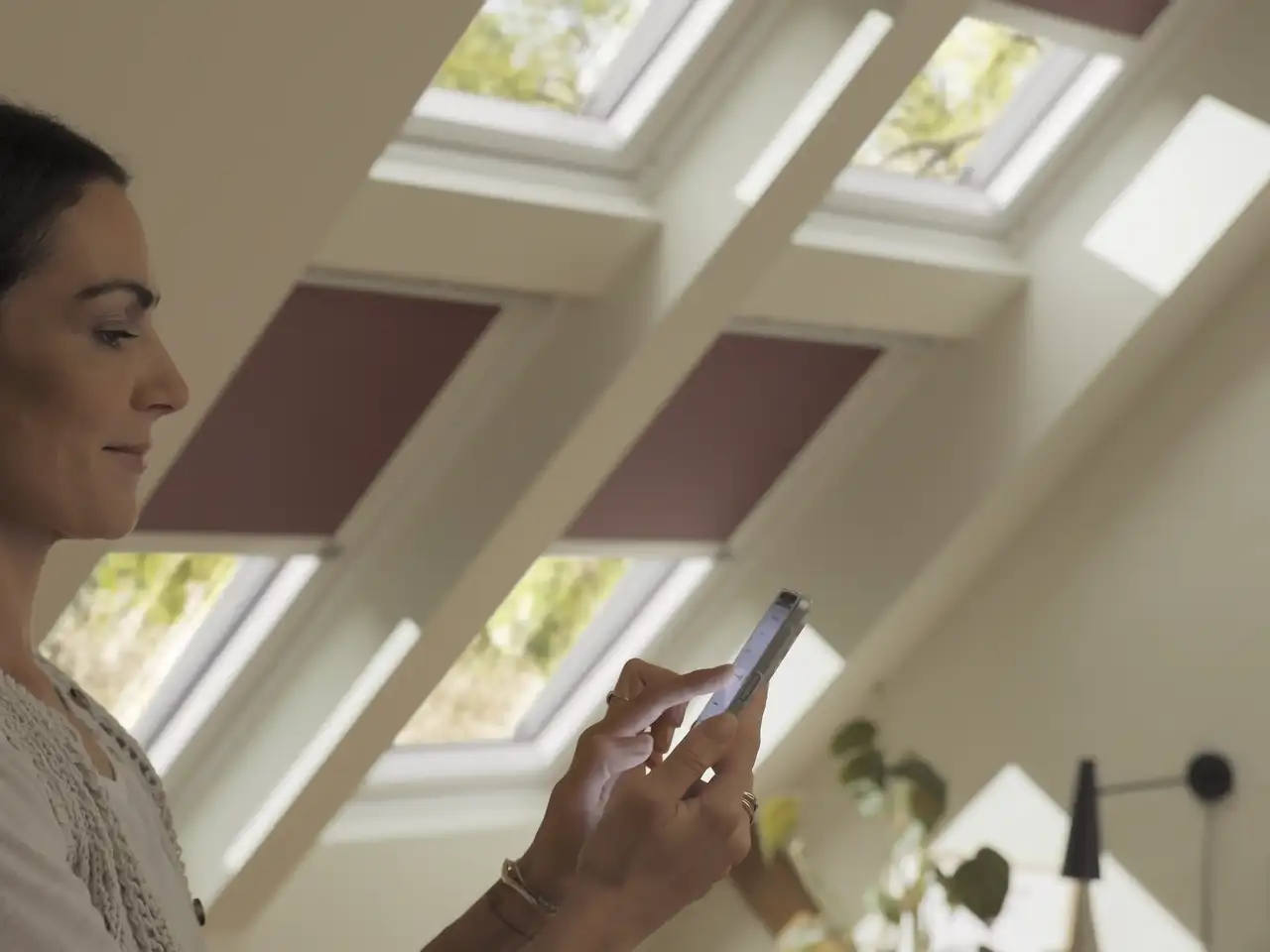 Attic room with VELUX roof windows, sloped ceiling, and natural light.